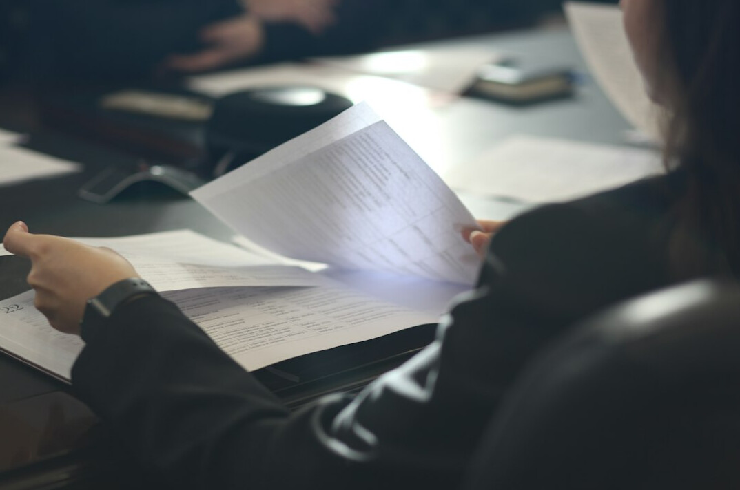 investigator reading files